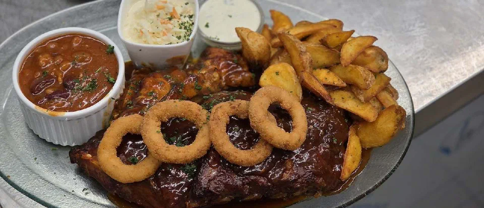 BBQ Combo with meat, onion rings, potato wedges and dips
